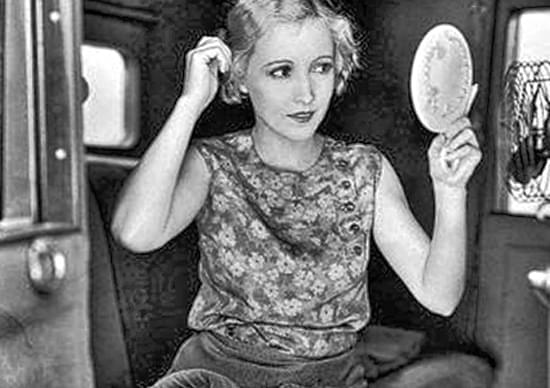 bessie love looking into a hand mirror