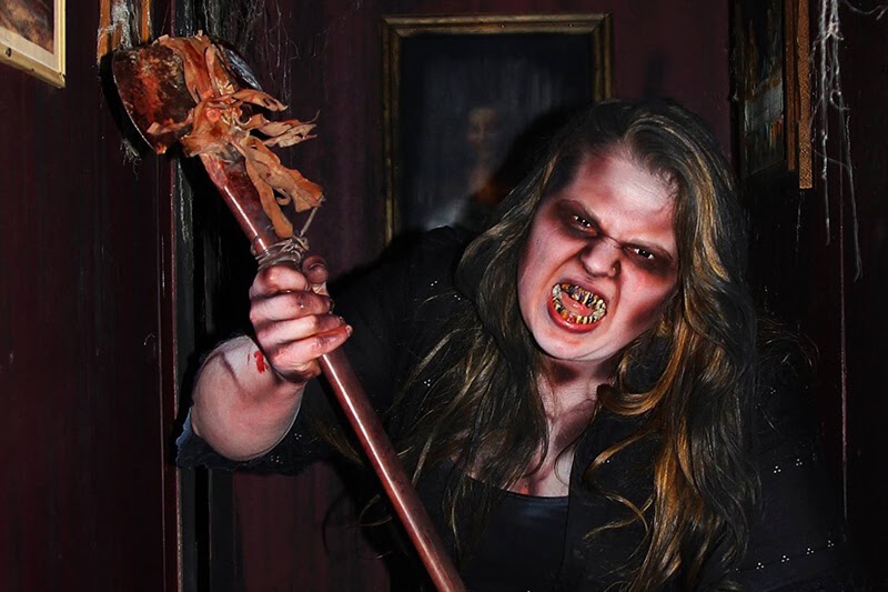 Horror in the Hollow haunted house in Arkansas possessed girl holding an axe