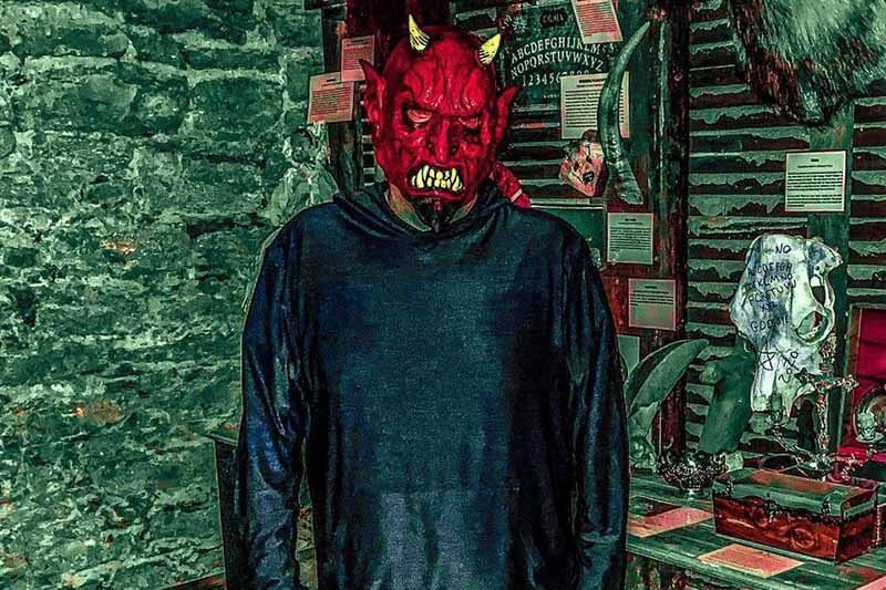 Museum Of Shadows haunted house in Nebraska psycho killer wearing a devil mask