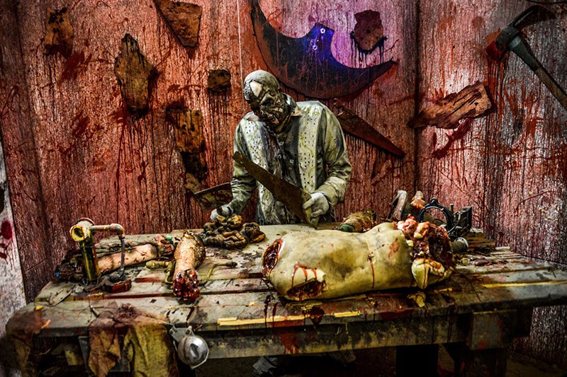 The SlaughterHouse haunted house in Arizona monster butcher cutting bodies
