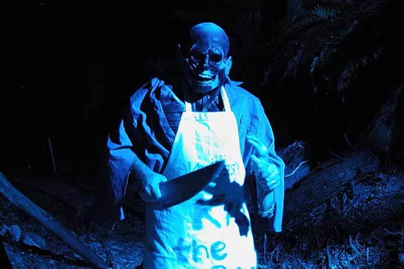 Frighthouse Station haunted house in Washington killer skull monster holding knifes